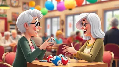 Two smiling elderly women with white hair and glasses are playing bingo at a table in a brightly decorated room with balloons. One woman holds a bingo cage, and bingo balls are scattered on the table.