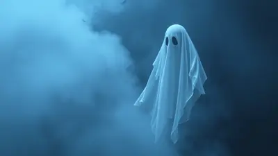 A white ghost costume with two black eye holes floats in a dark, foggy blue atmosphere, with faint silhouettes of birds in the upper left corner.